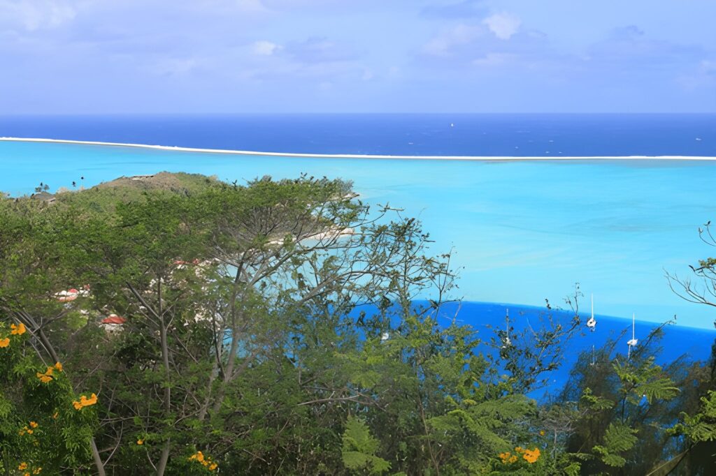 Overwater bungalows. sitting above clear lagoon water.